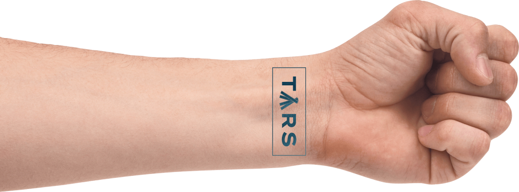 Tars logo tattooed on a wrist